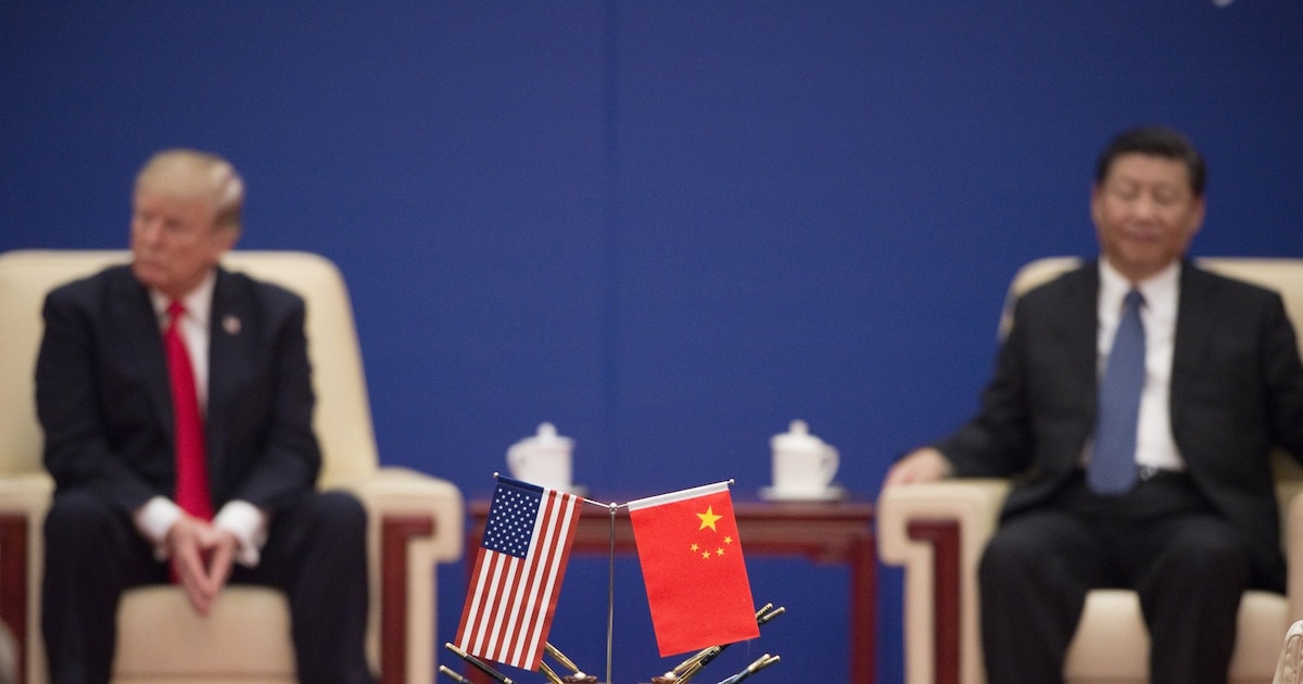 Le président américain Donald Trump et son homologue chinois Xi Jinping, lors d'une recontre avec des dirigeants d'entreprises à Pékin, le 9 novembre 2017